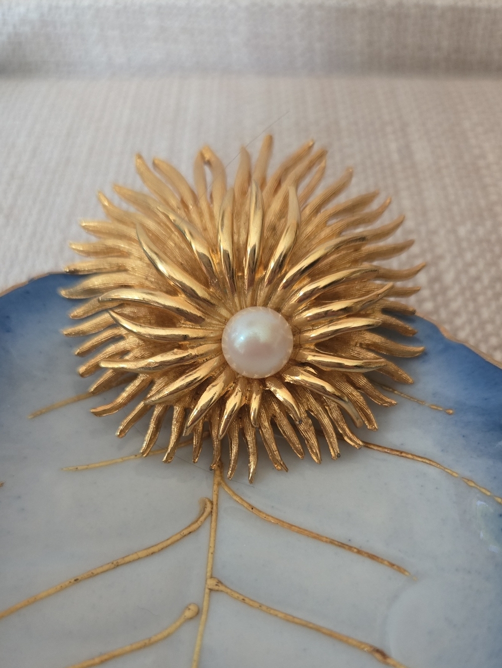 Gold Sunburst Brooch with Pearl Center